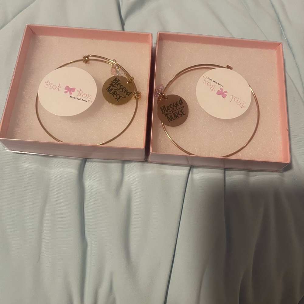 Bundle Gold and rose gold bracelets with a Blessed Nurse tag.